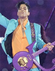 Prince holding a guitar